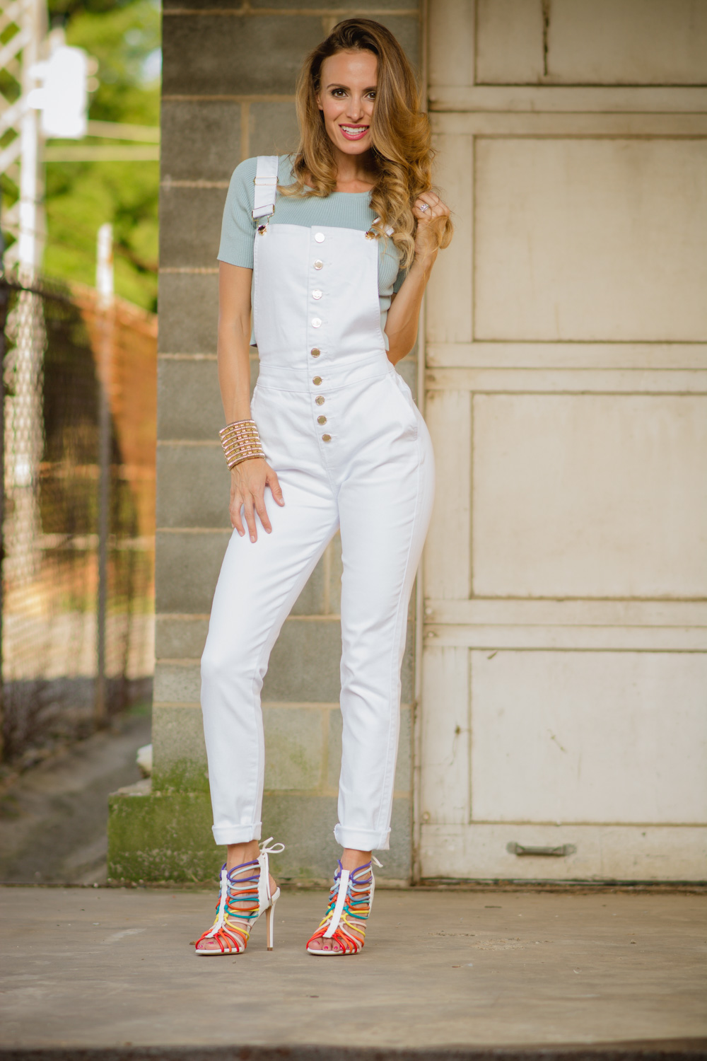 Samantha Busch in white overalls